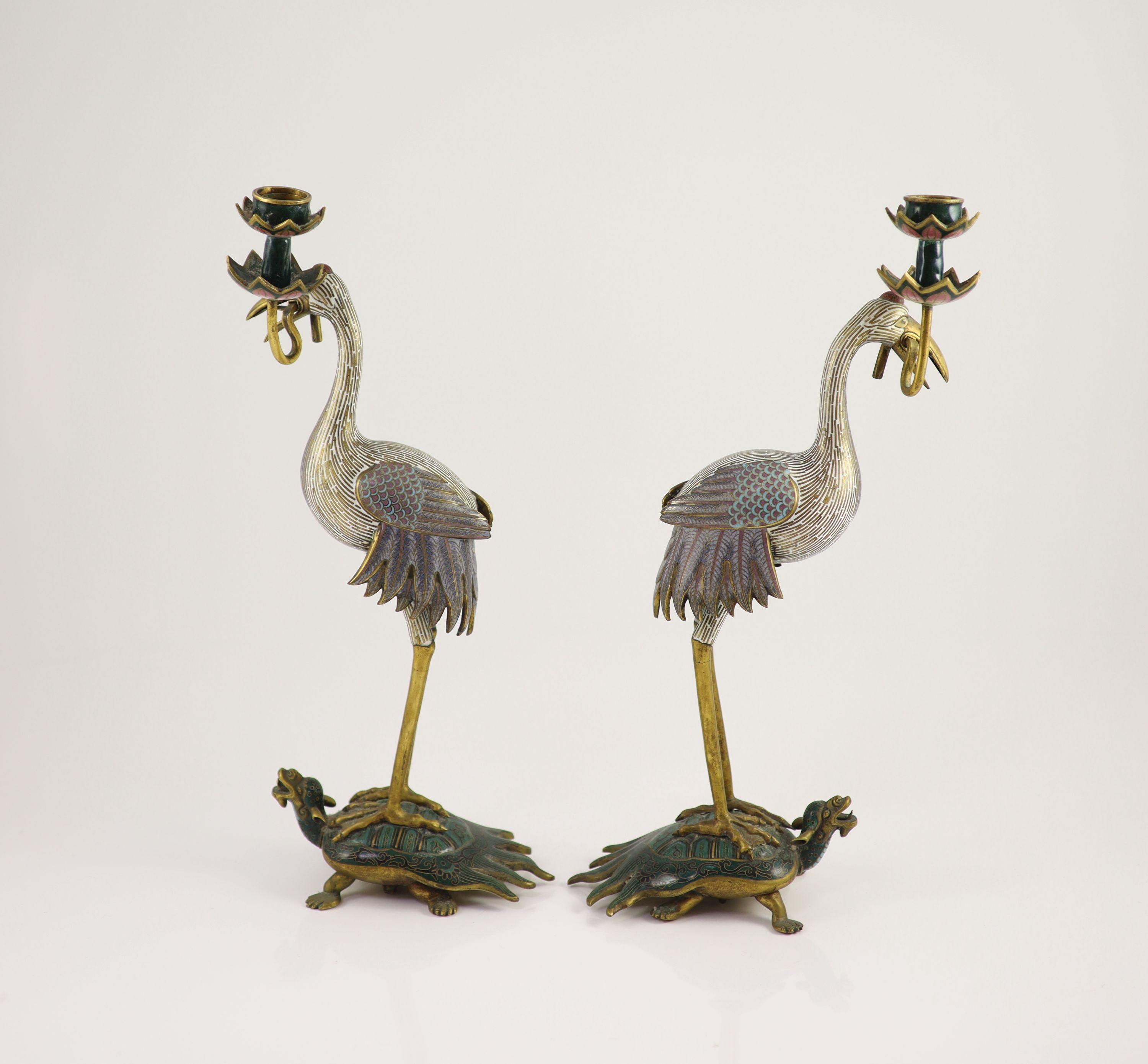A pair of Chinese cloisonné enamel and gilt bronze ’crane’ candlesticks, early 20th century, 38cm high